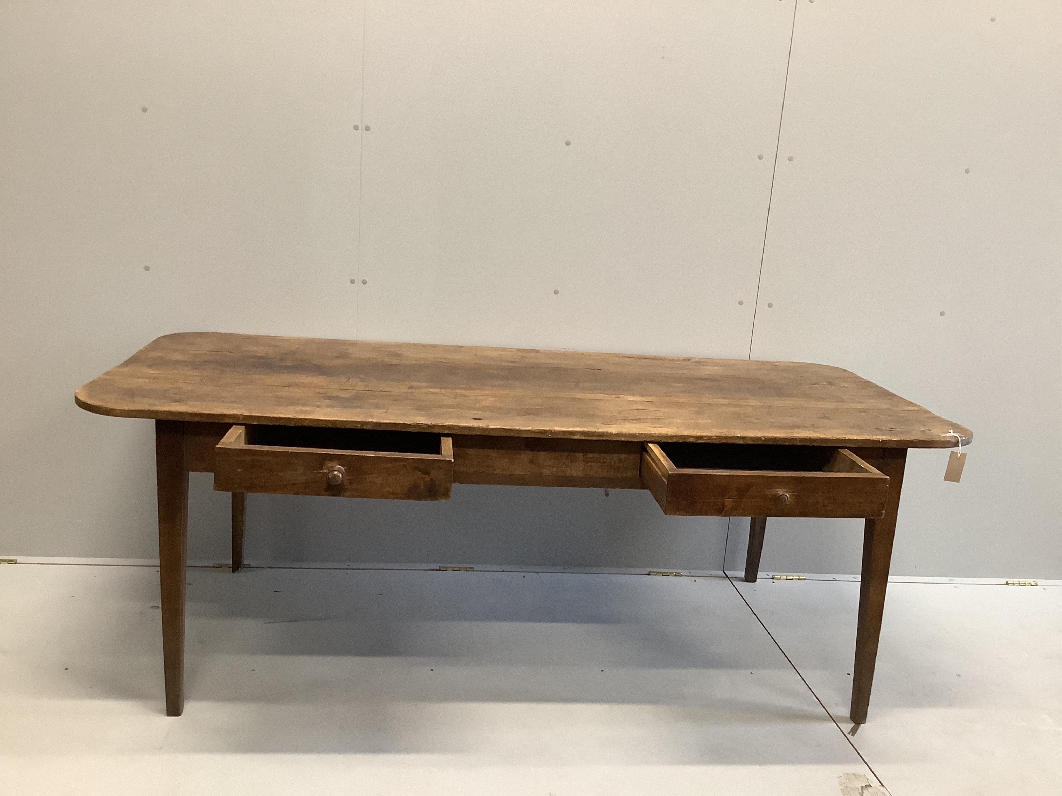 A 19th century French rectangular fruitwood kitchen table, width 200cm, depth 88cm, height 72cm. Condition - fair